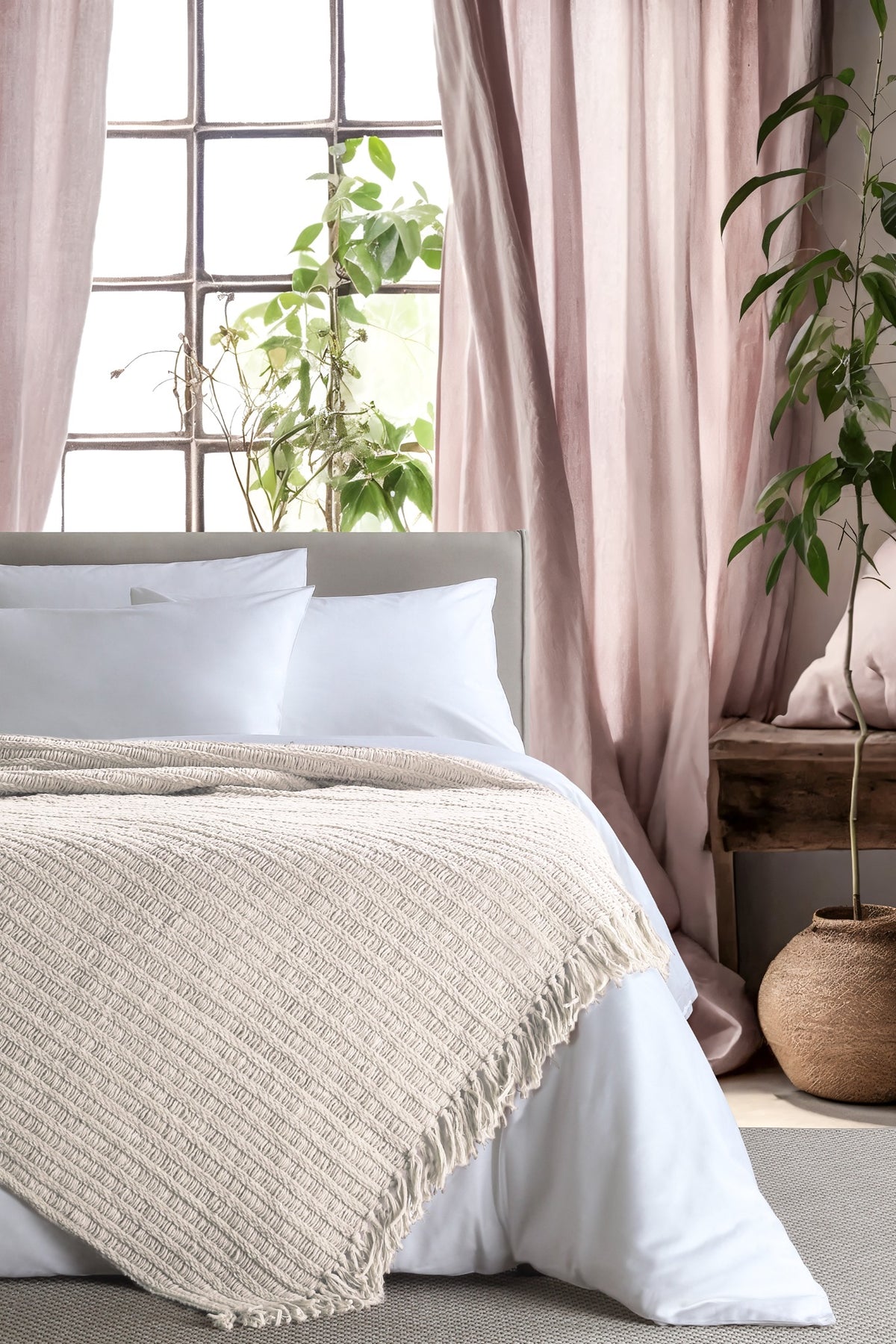 Amara Ecru throw — styled on a bed