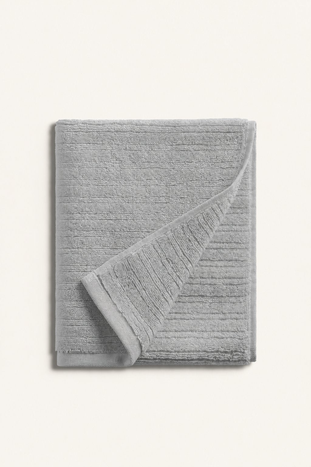 Pavia Home Aviola — Folded grey towels