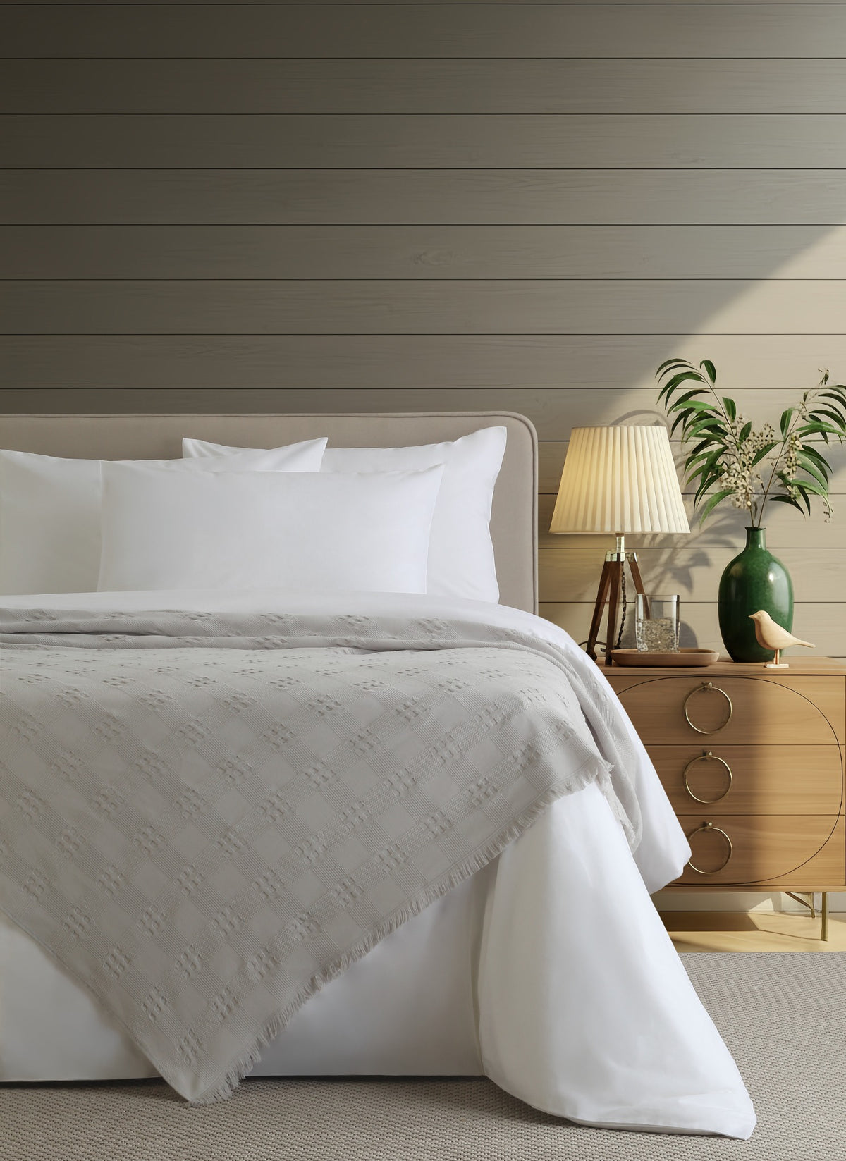 Danna Grey bedspread styled on a bed