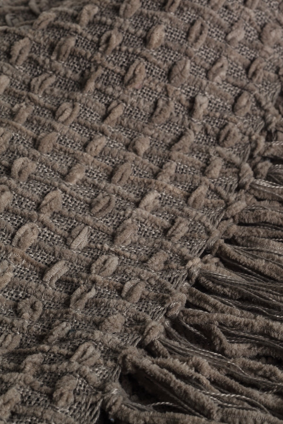 Devina Grey throw — woven texture and tassel detail