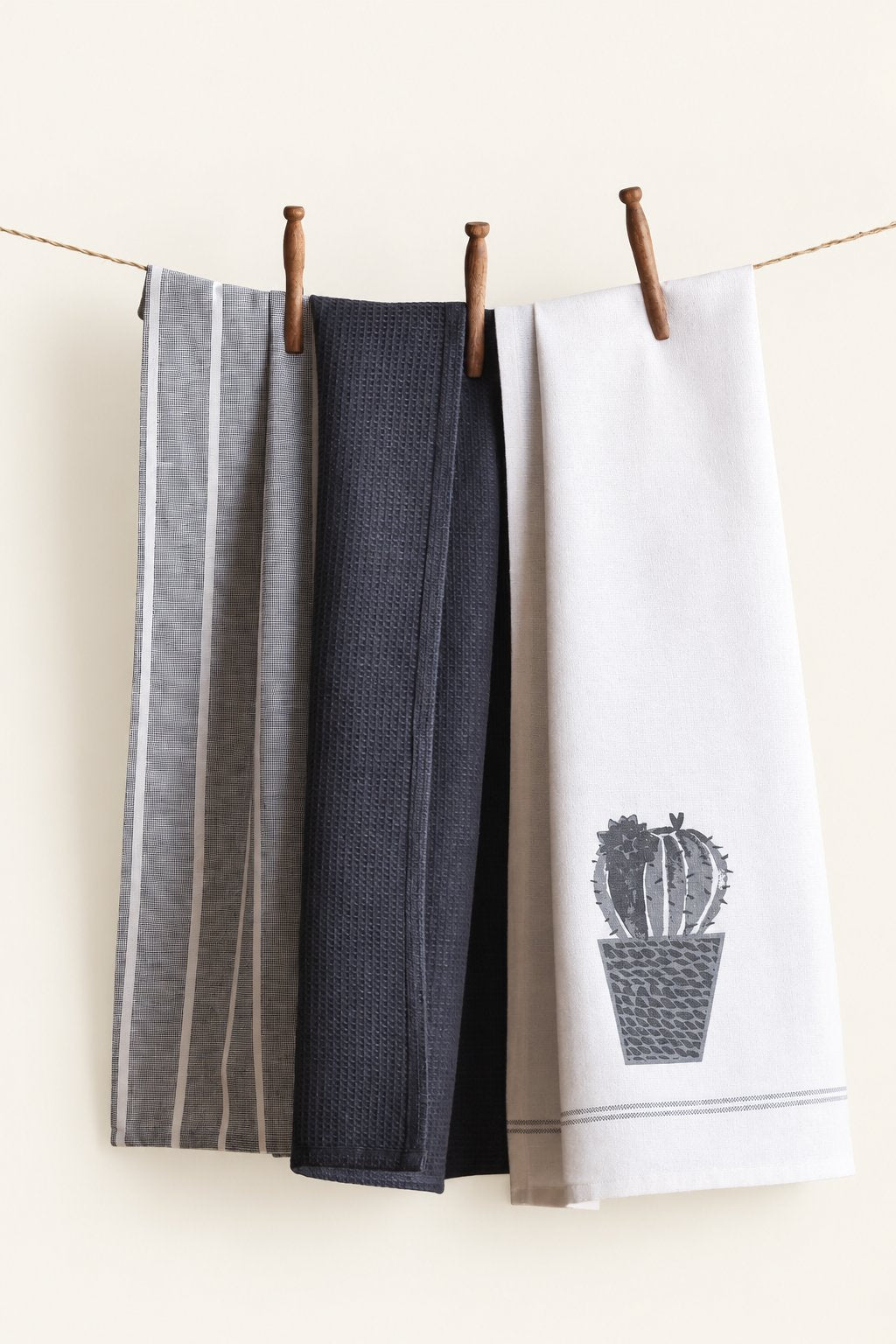 Pavia KT-05 kitchen towels — set of three displayed on a clothesline