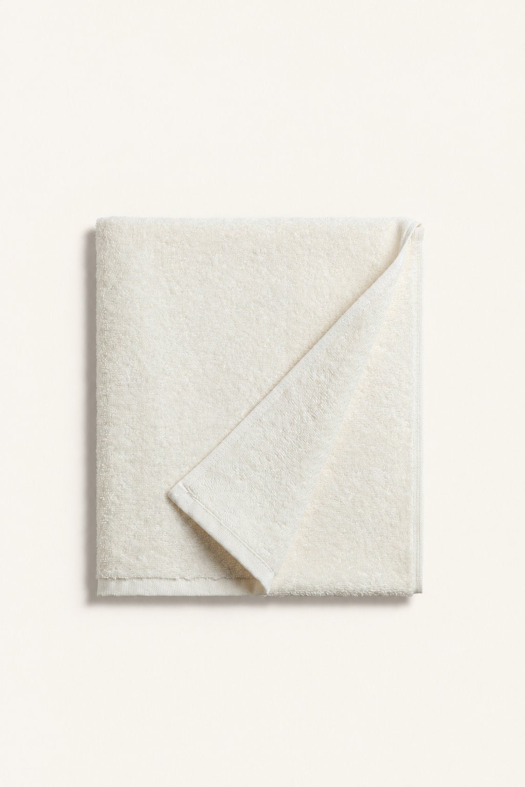 Folded Nicol towel in Ecru