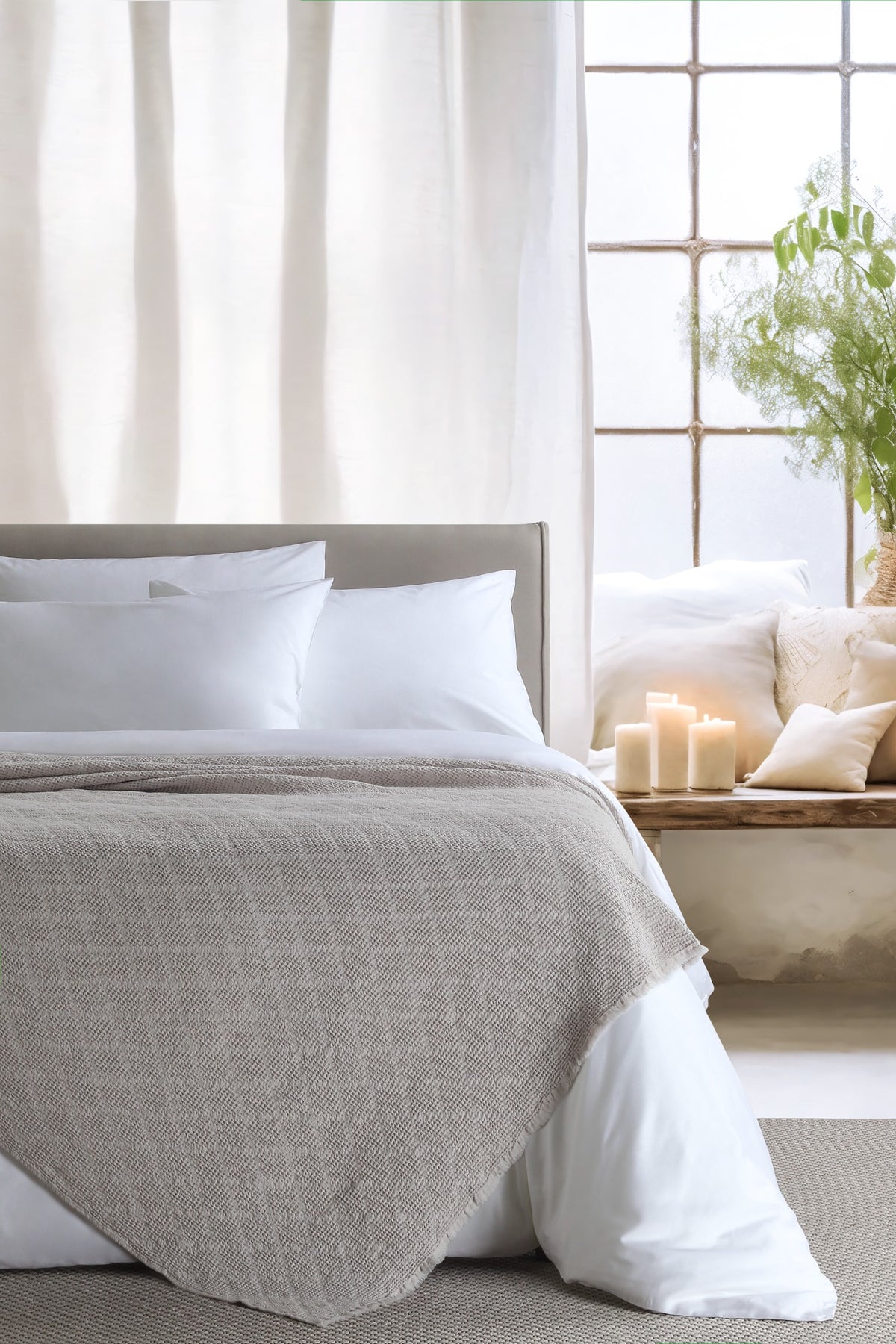 Noyce Beige throw — styled on a bed