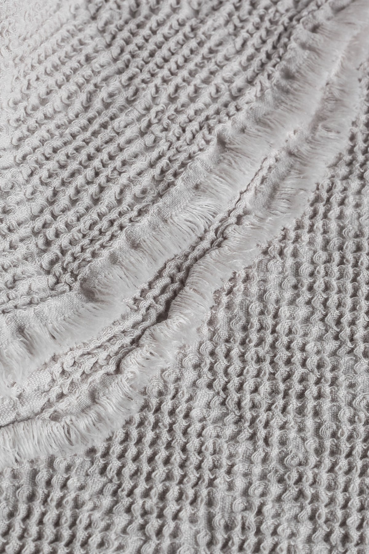 Noyce Beige throw — texture and fringe detail