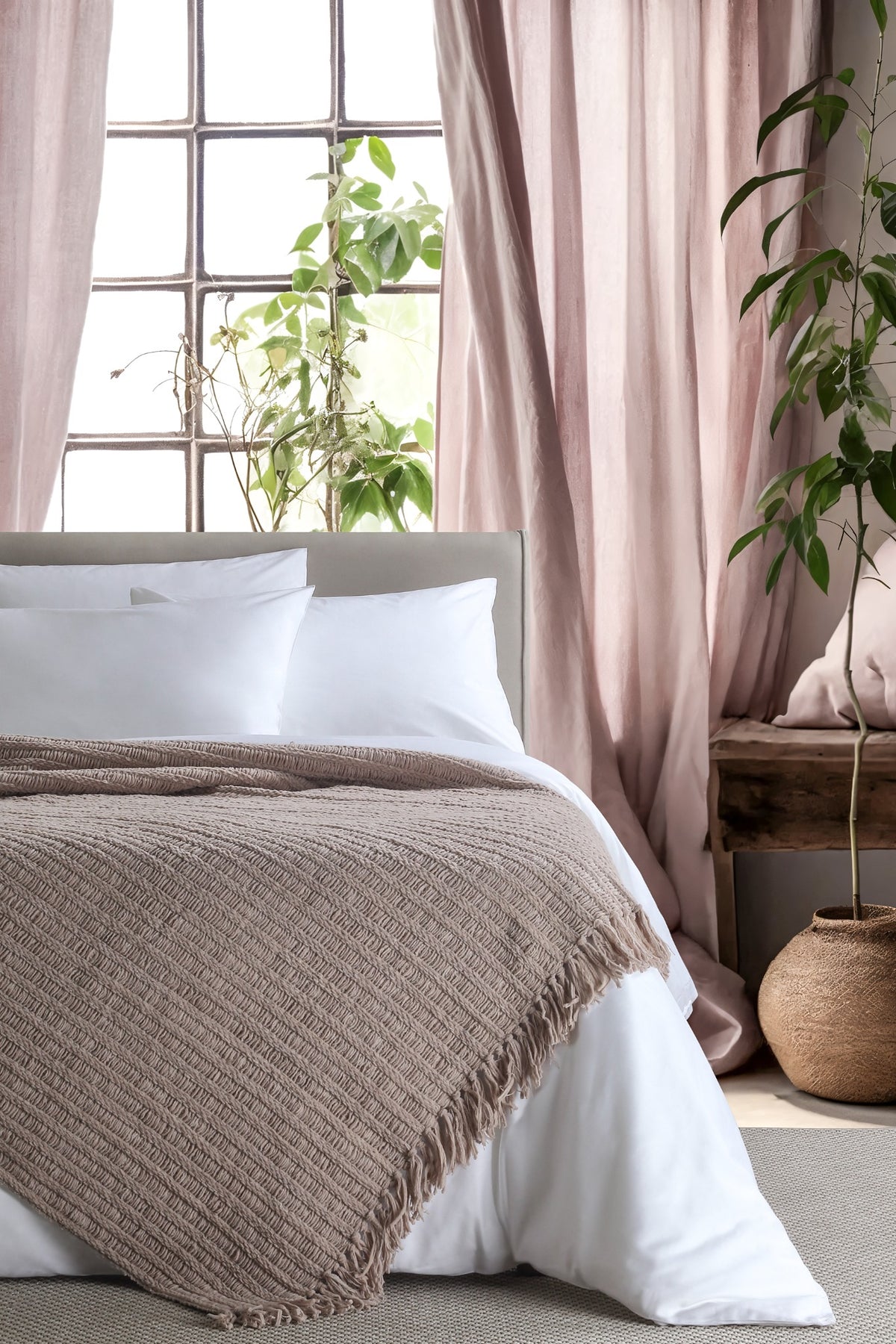 Amara Beige throw — styled on a bed