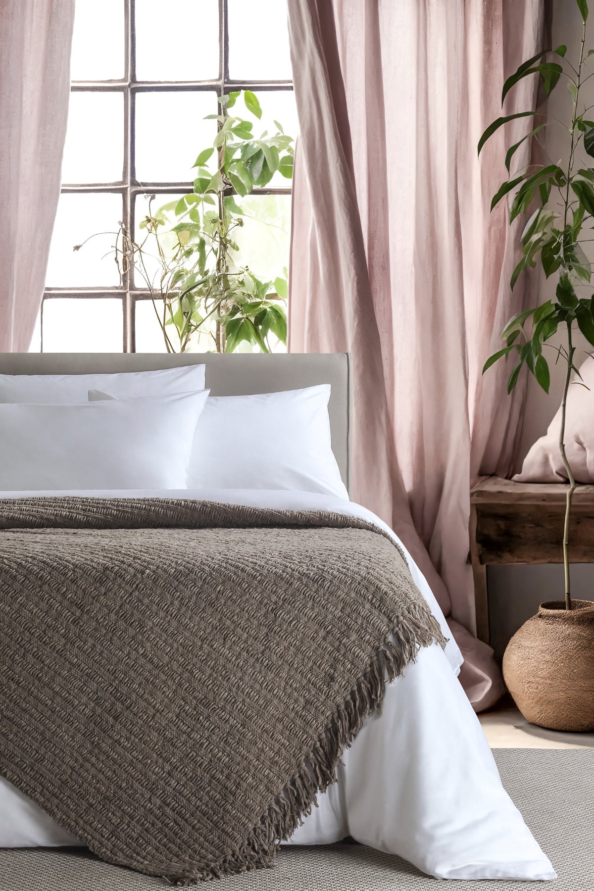 Amara Grey throw — styled on a bed
