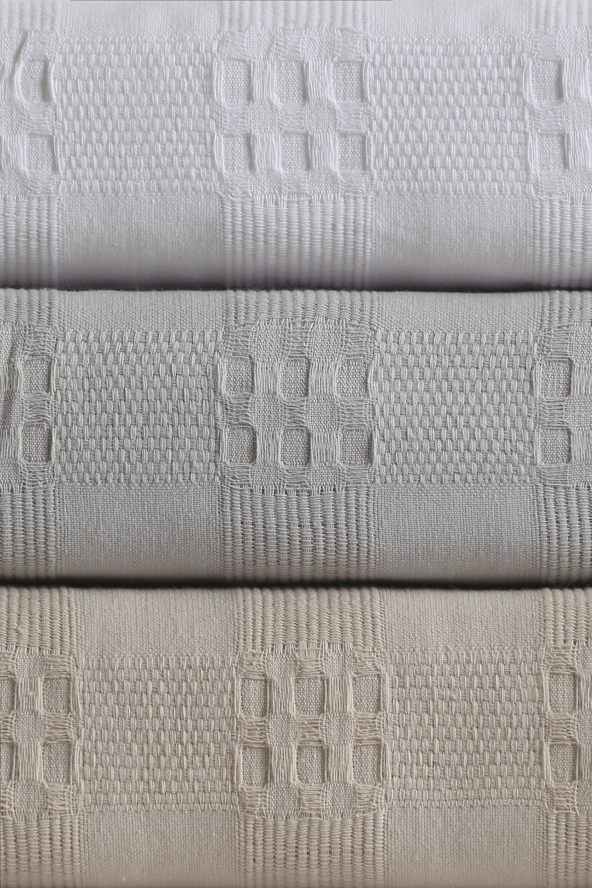 Danna bedspread colour range and woven geometric texture
