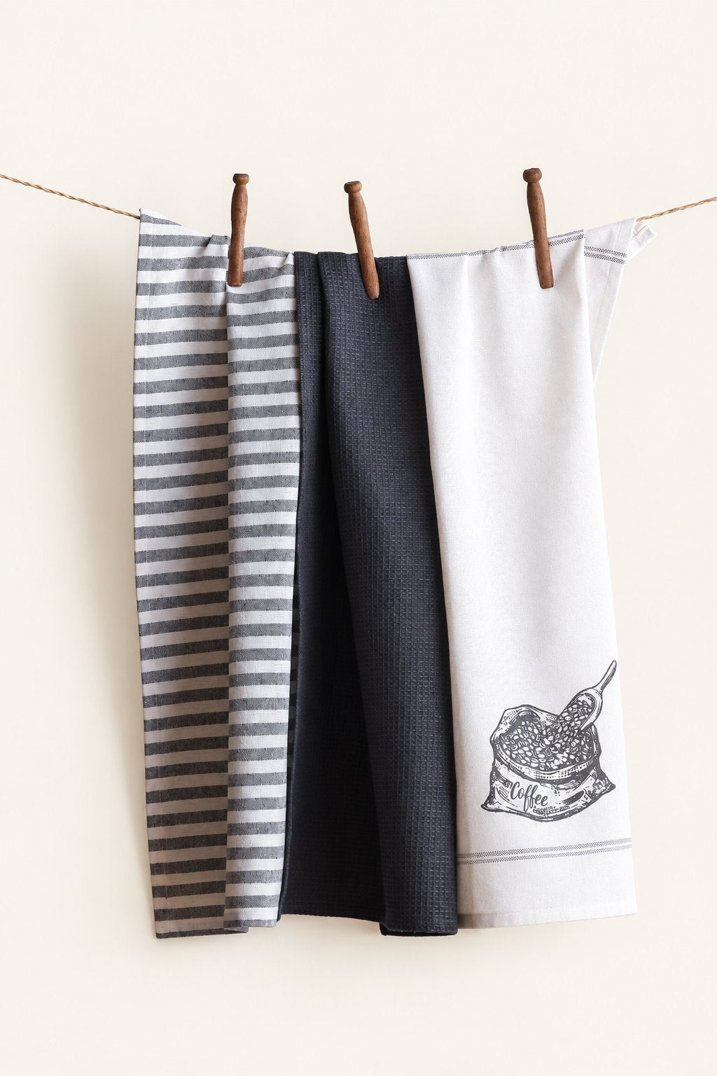 Pavia KT-02 kitchen towels — set of three displayed on a clothesline