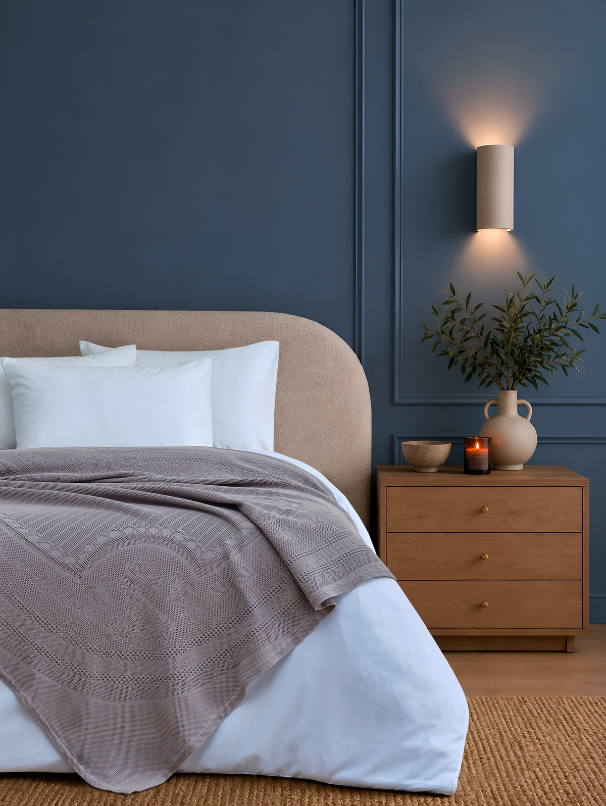 Morella Beige decorative throw styled on a bed