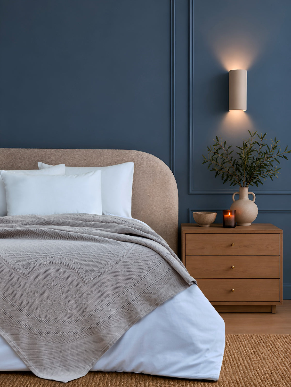 Morella Grey decorative throw styled on a bed