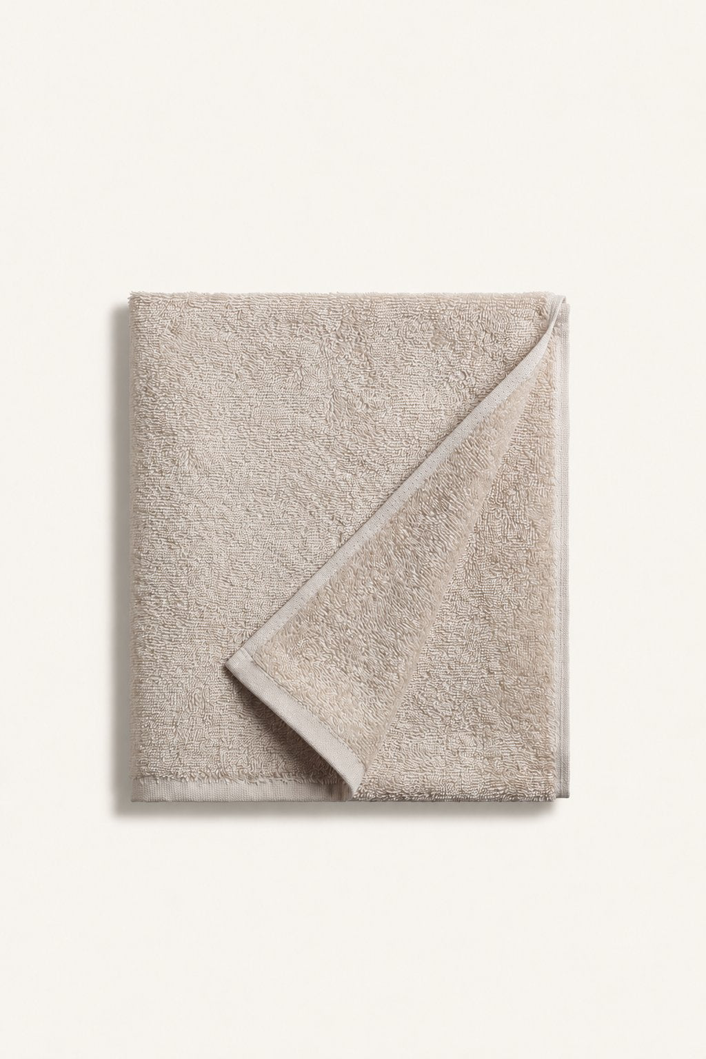Folded Nicol towel in Beige